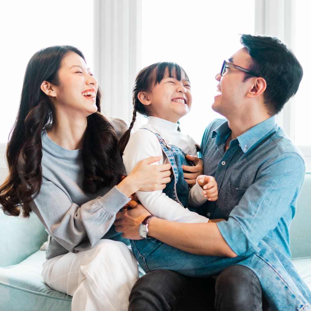 A small child is pretending to play the piano.